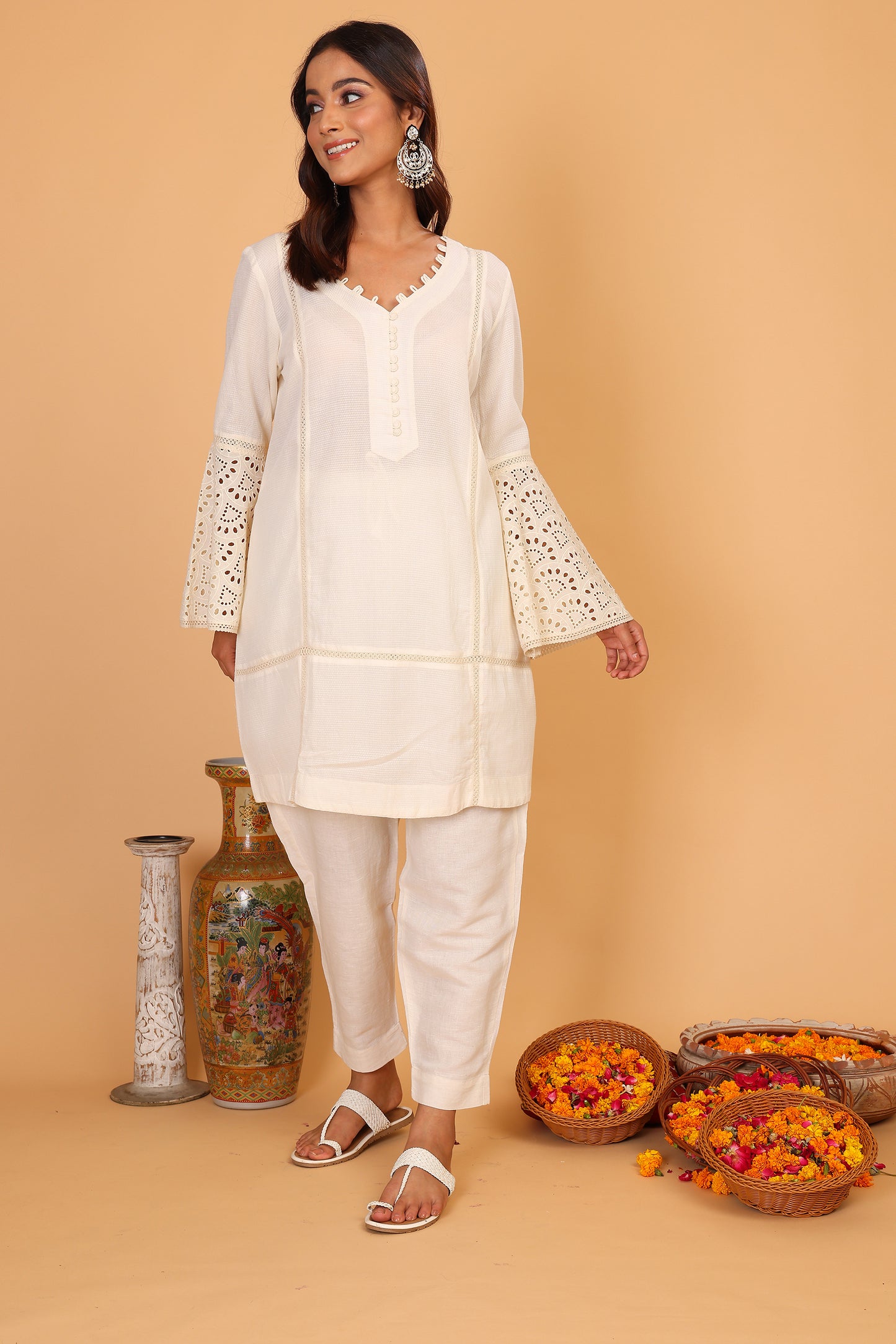 Off white textured kurta with lace detailed sleeves  and pants