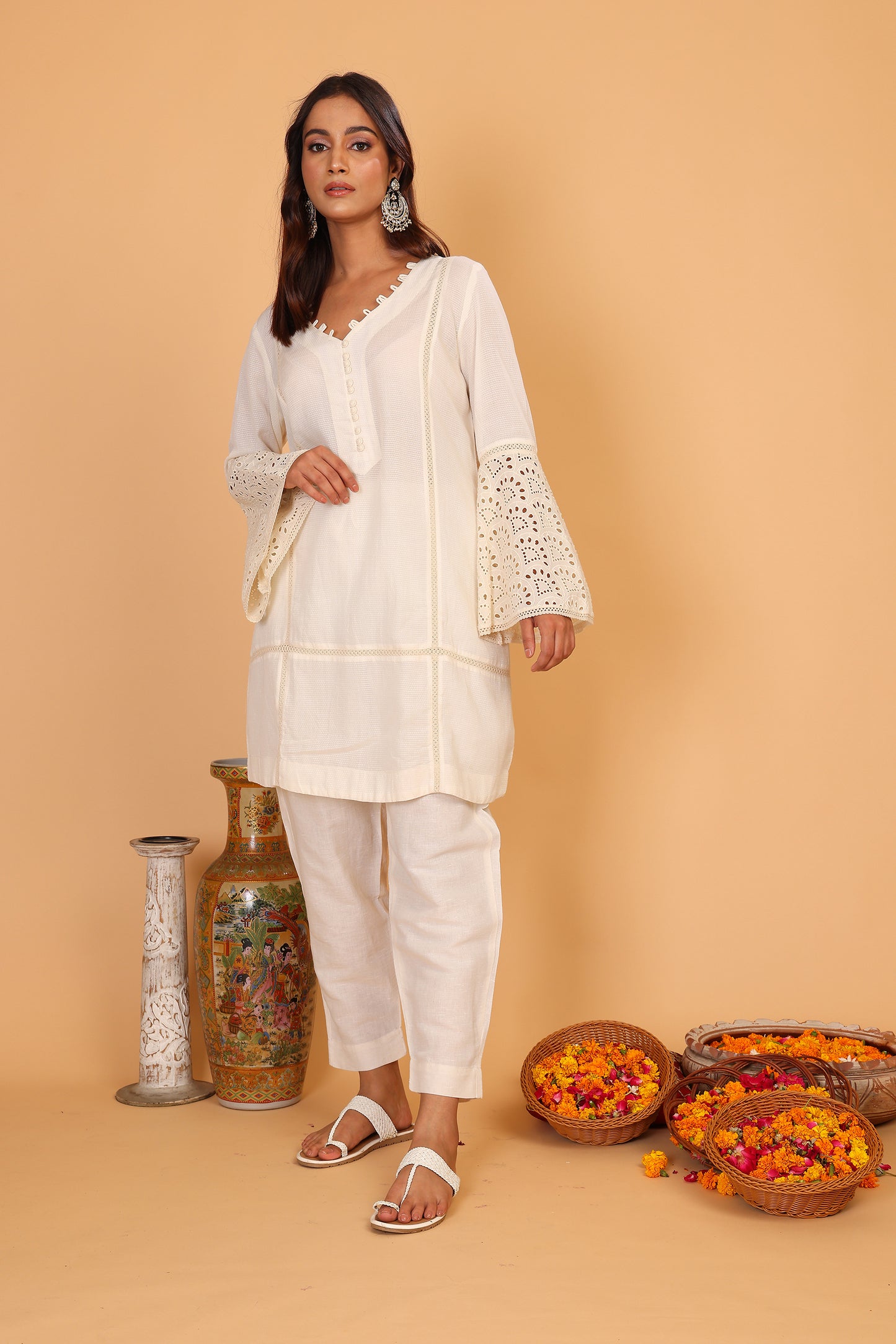 Off white textured kurta with lace detailed sleeves  and pants