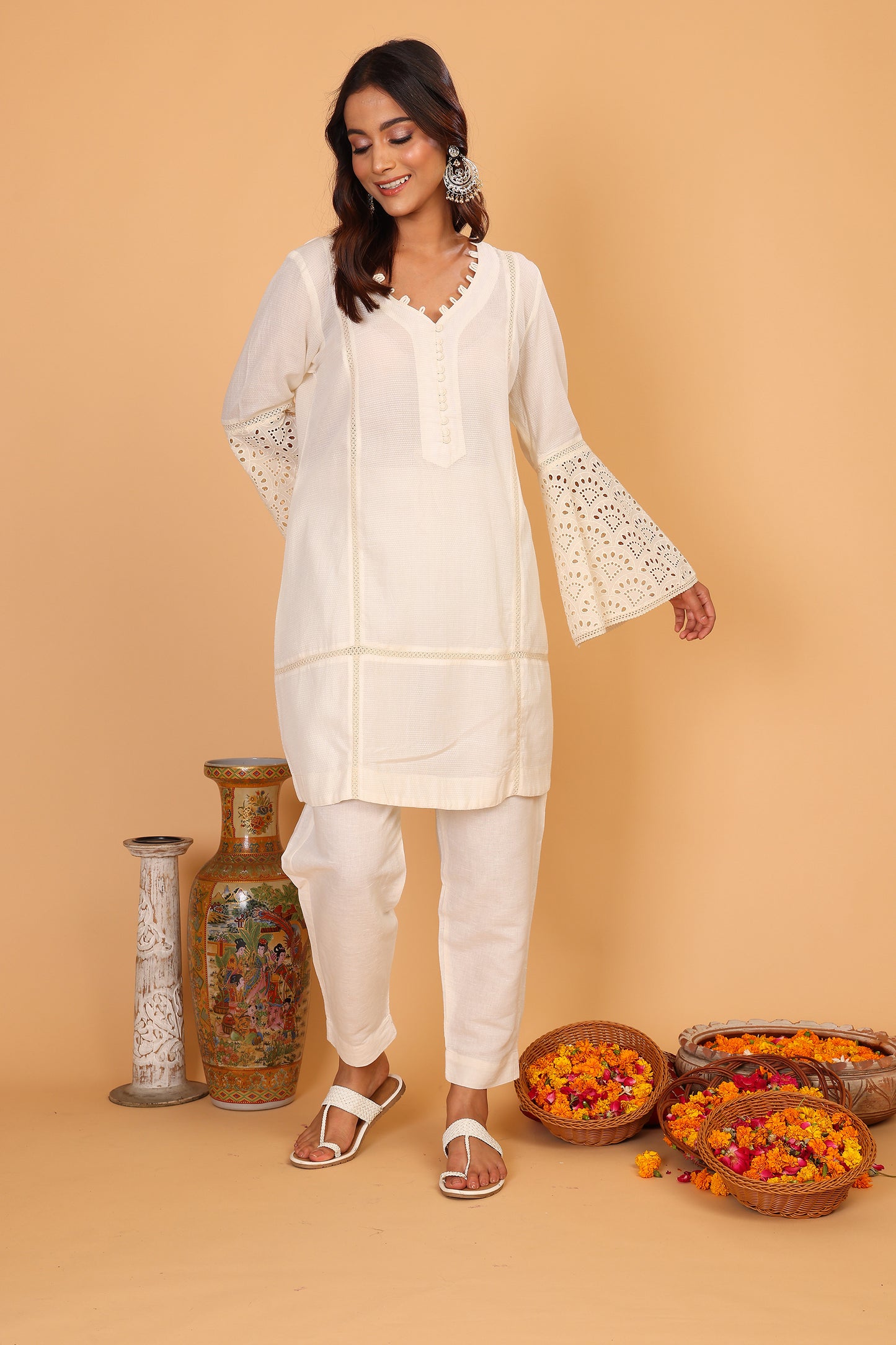 Off white textured kurta with lace detailed sleeves  and pants