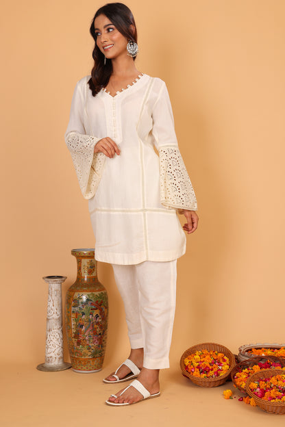 Off white textured kurta with lace detailed sleeves  and pants