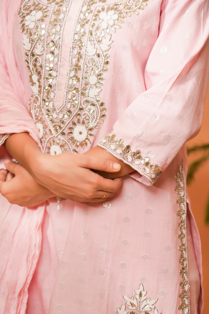 Pink lurex kurta with bead work on the neckline paired with sequin garara