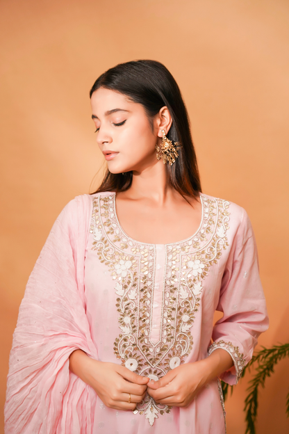 Pink lurex kurta with bead work on the neckline paired with sequin garara