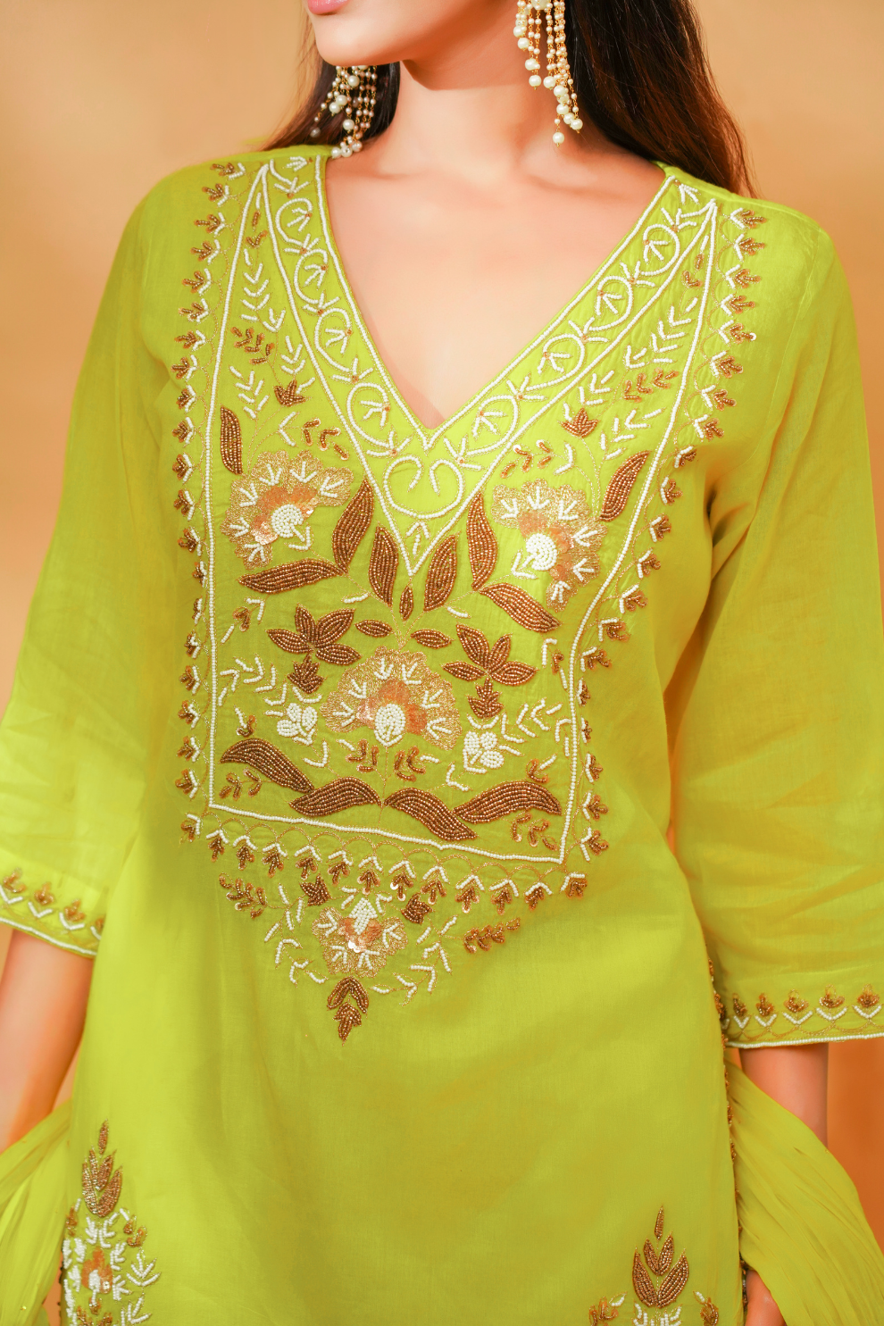 Lime kurta with floral embroidered yoke paired with sequins garara