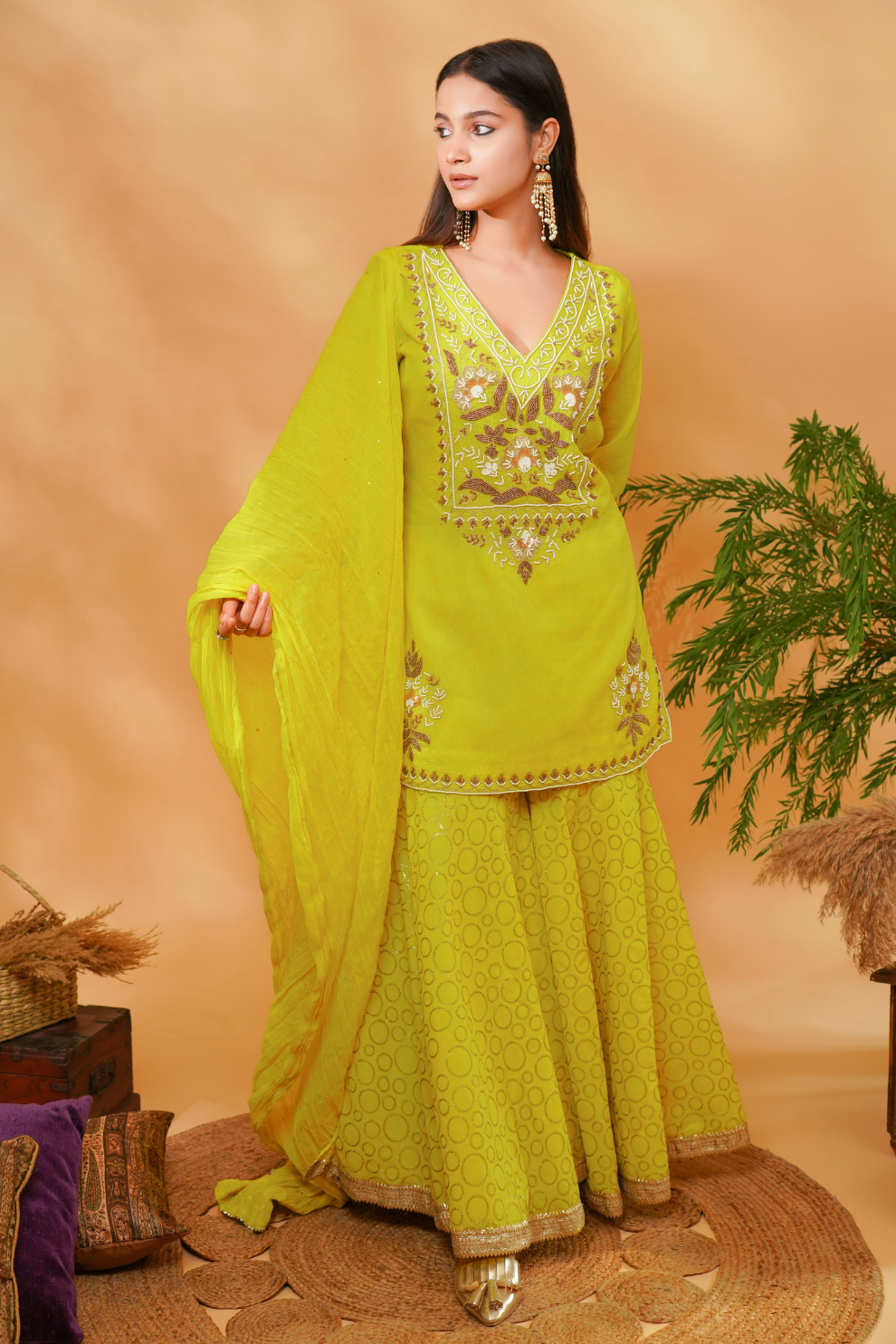 Lime kurta with floral embroidered yoke paired with sequins garara