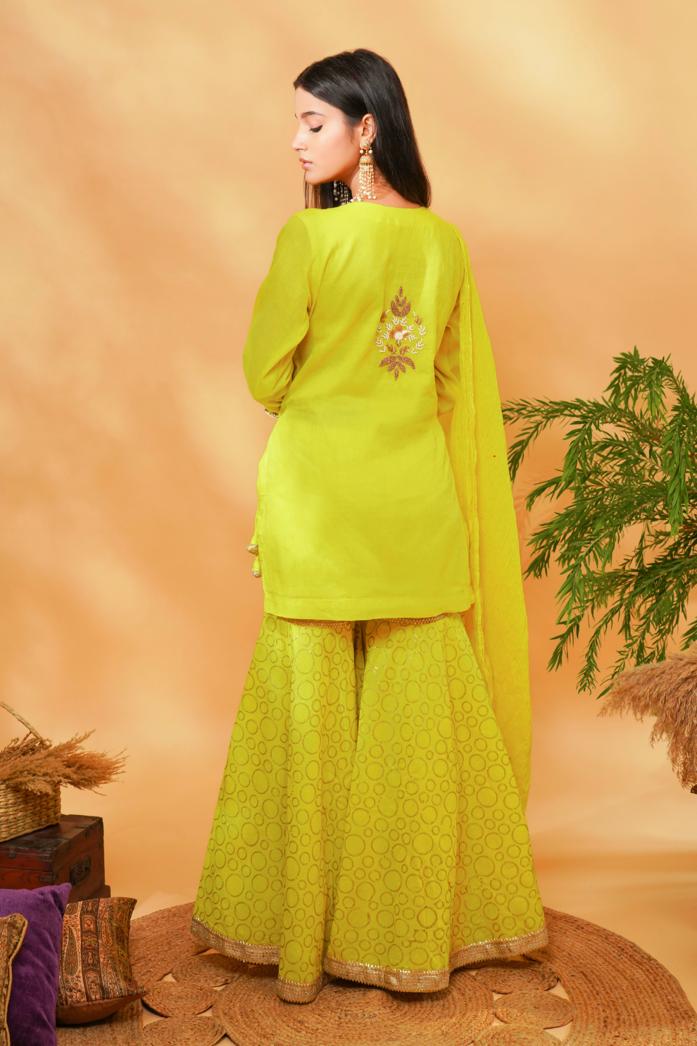 Lime kurta with floral embroidered yoke paired with sequins garara