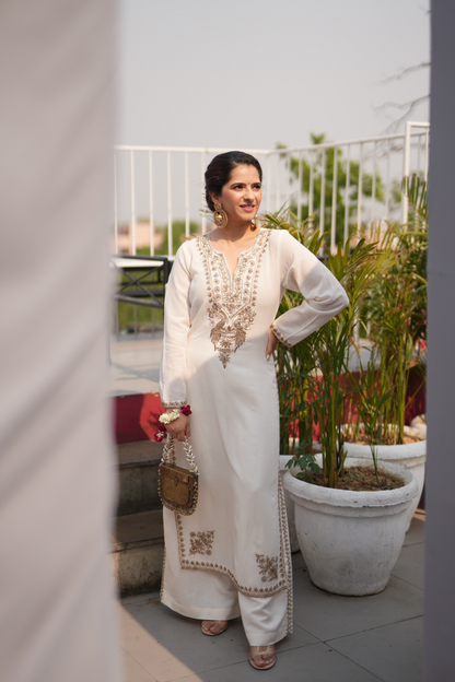 Ivory kurta with embroidered peacocks