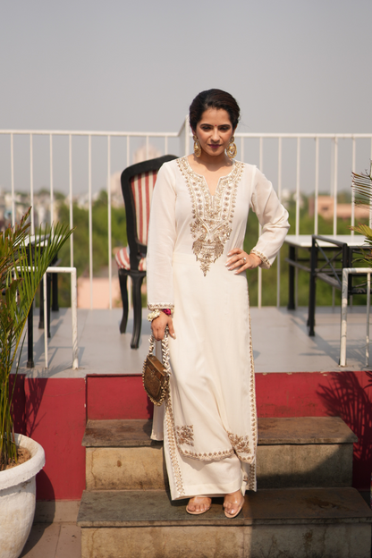 Ivory kurta with embroidered peacocks