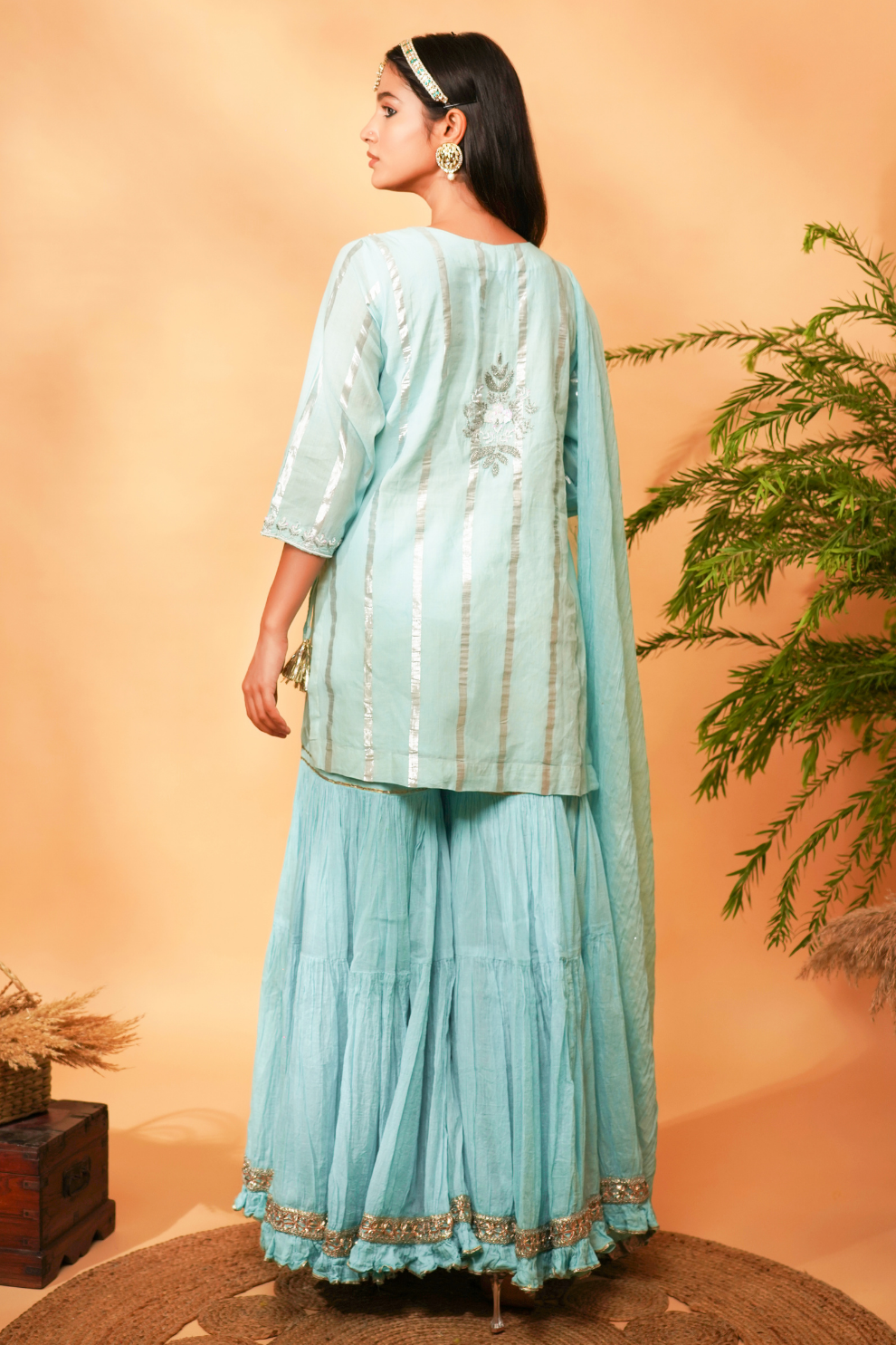 Blue embroidered short kurta paired with a Gharara