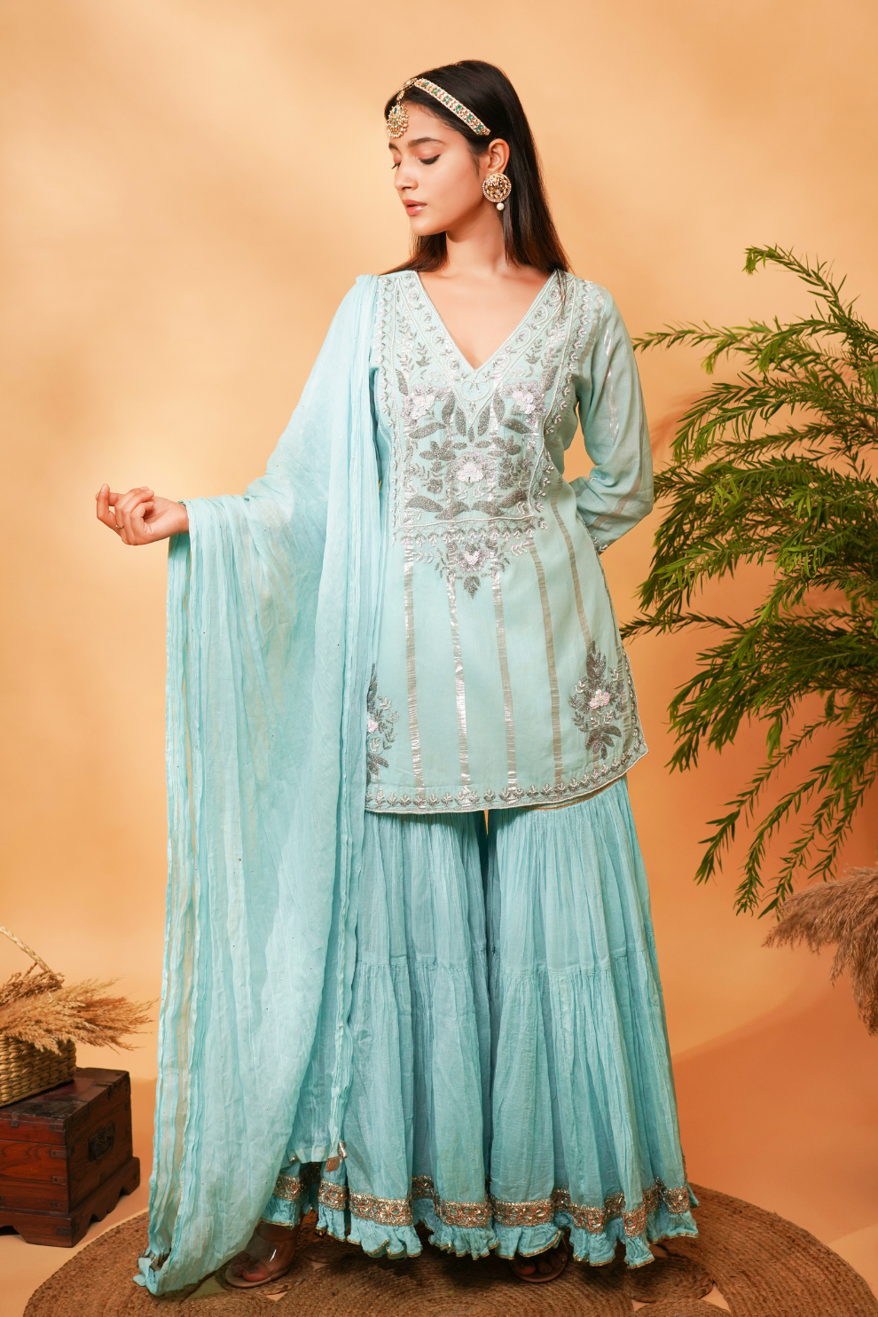 Blue embroidered short kurta paired with a Gharara