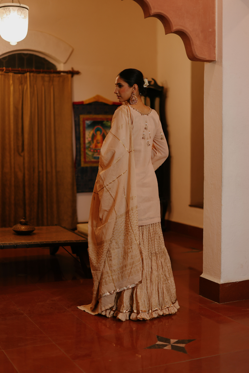 Beige kurta with delicate embroideries and printed skirt and dupatta