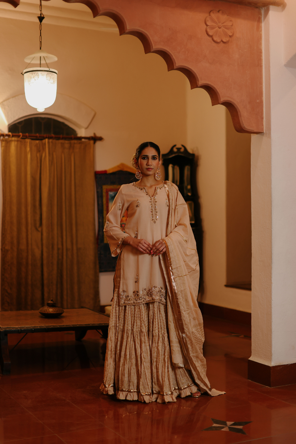 Beige kurta with delicate embroideries and printed skirt and dupatta