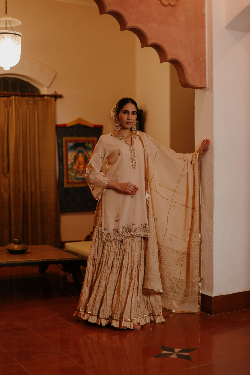 Beige kurta with delicate embroideries and printed skirt and dupatta