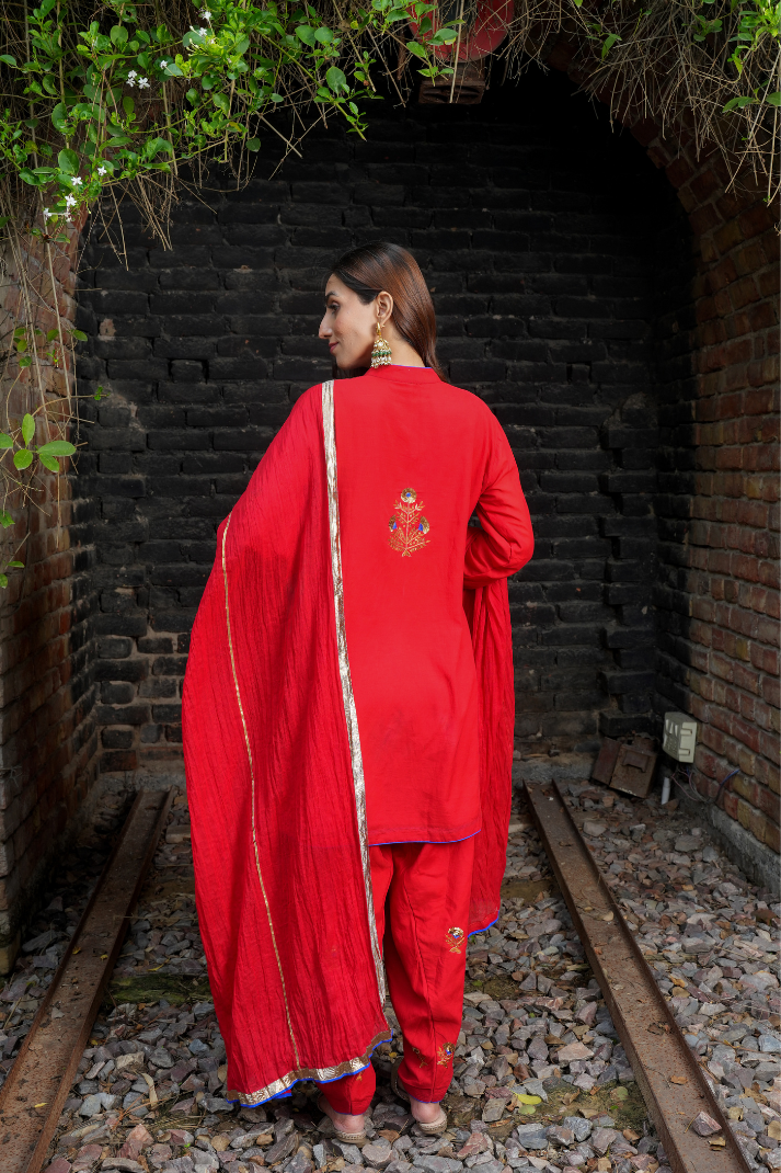 A red kurta with zari embroidery pant