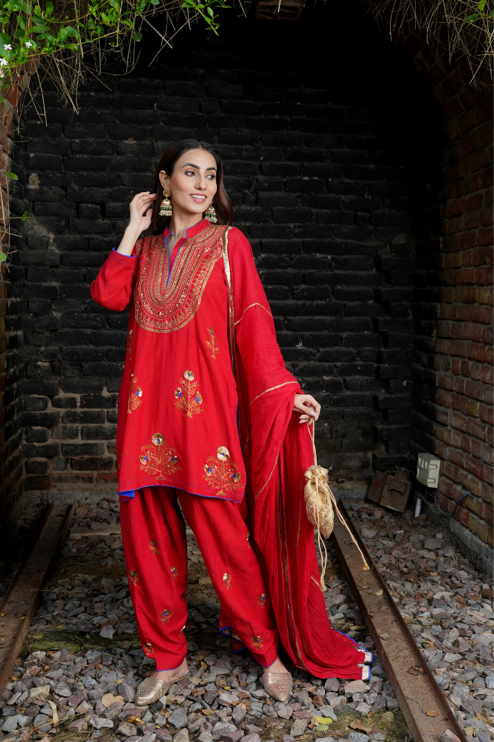 A red kurta with zari embroidery pant