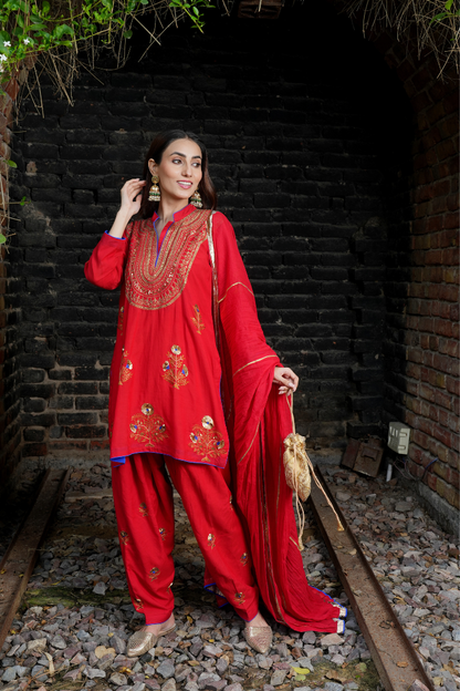 A red kurta with zari embroidery pant