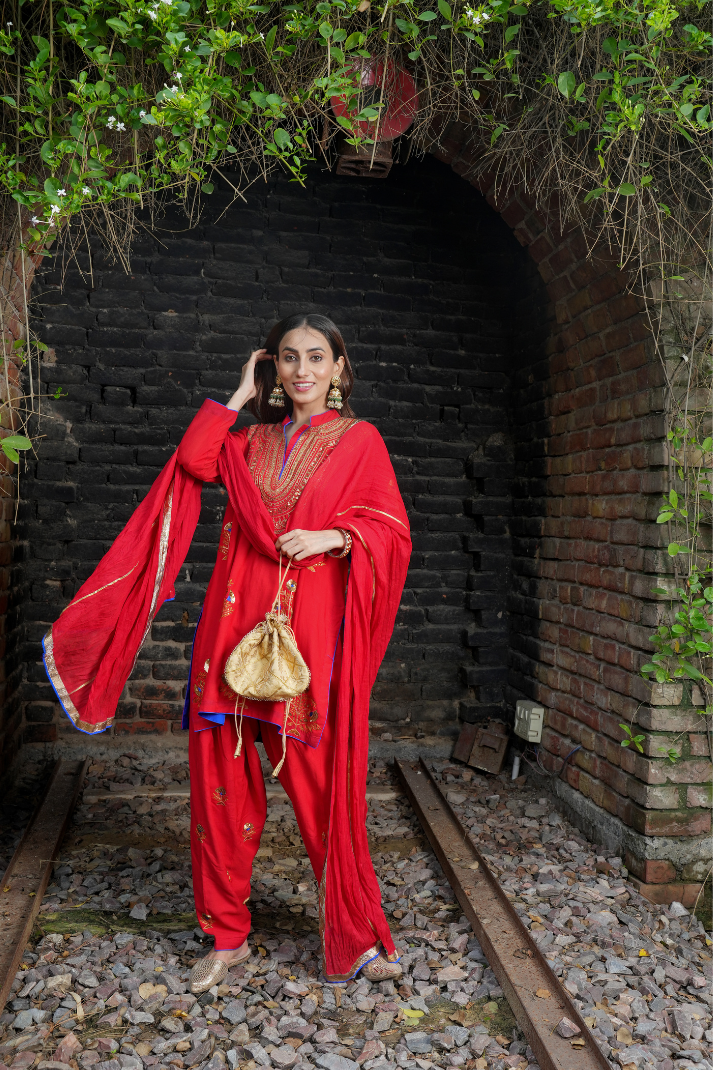 A red kurta with zari embroidery pant
