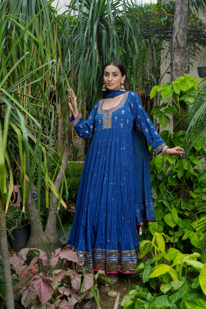 A blue anarkali  with delicate gold motifs
