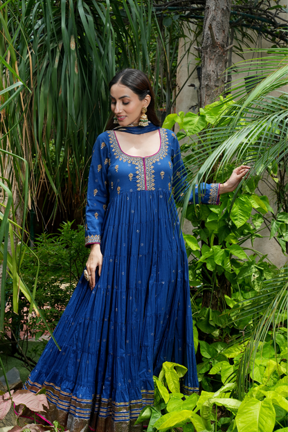 A blue anarkali  with delicate gold motifs