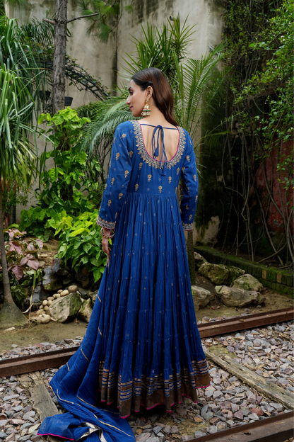 A blue anarkali  with delicate gold motifs