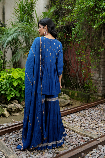 A deep blue short kurta Paired with flared sharara