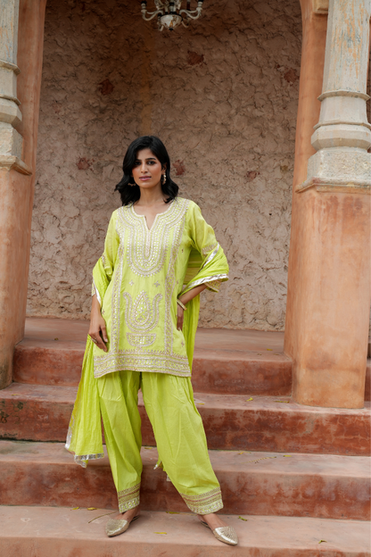 A vibrant lime-green kurta Paired with a flowy salwar