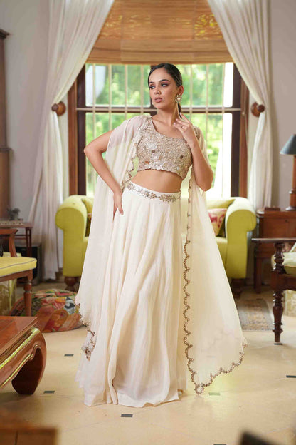 Mirror work blouse with lehenga and cape