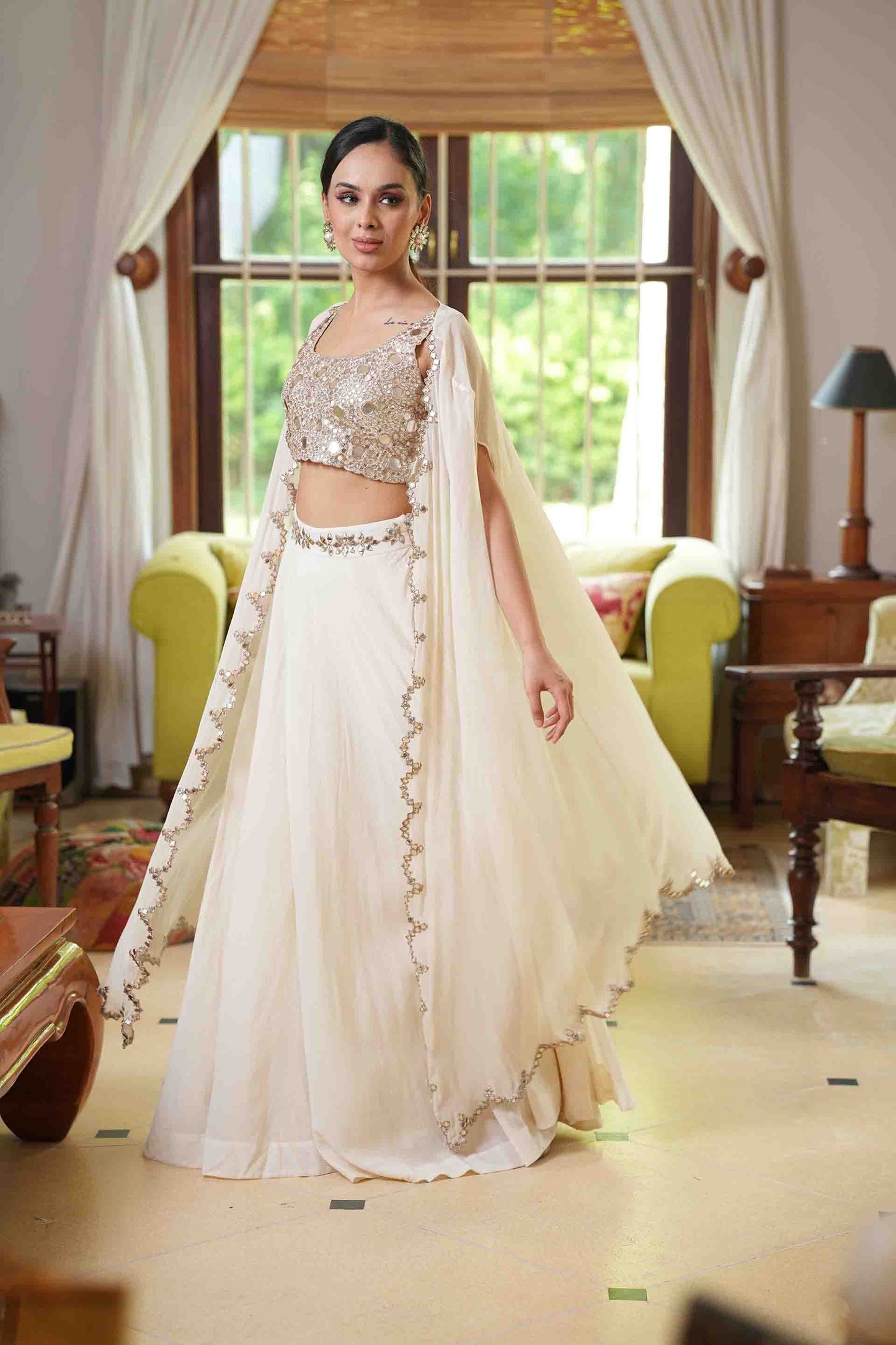 Mirror work blouse with lehenga and cape