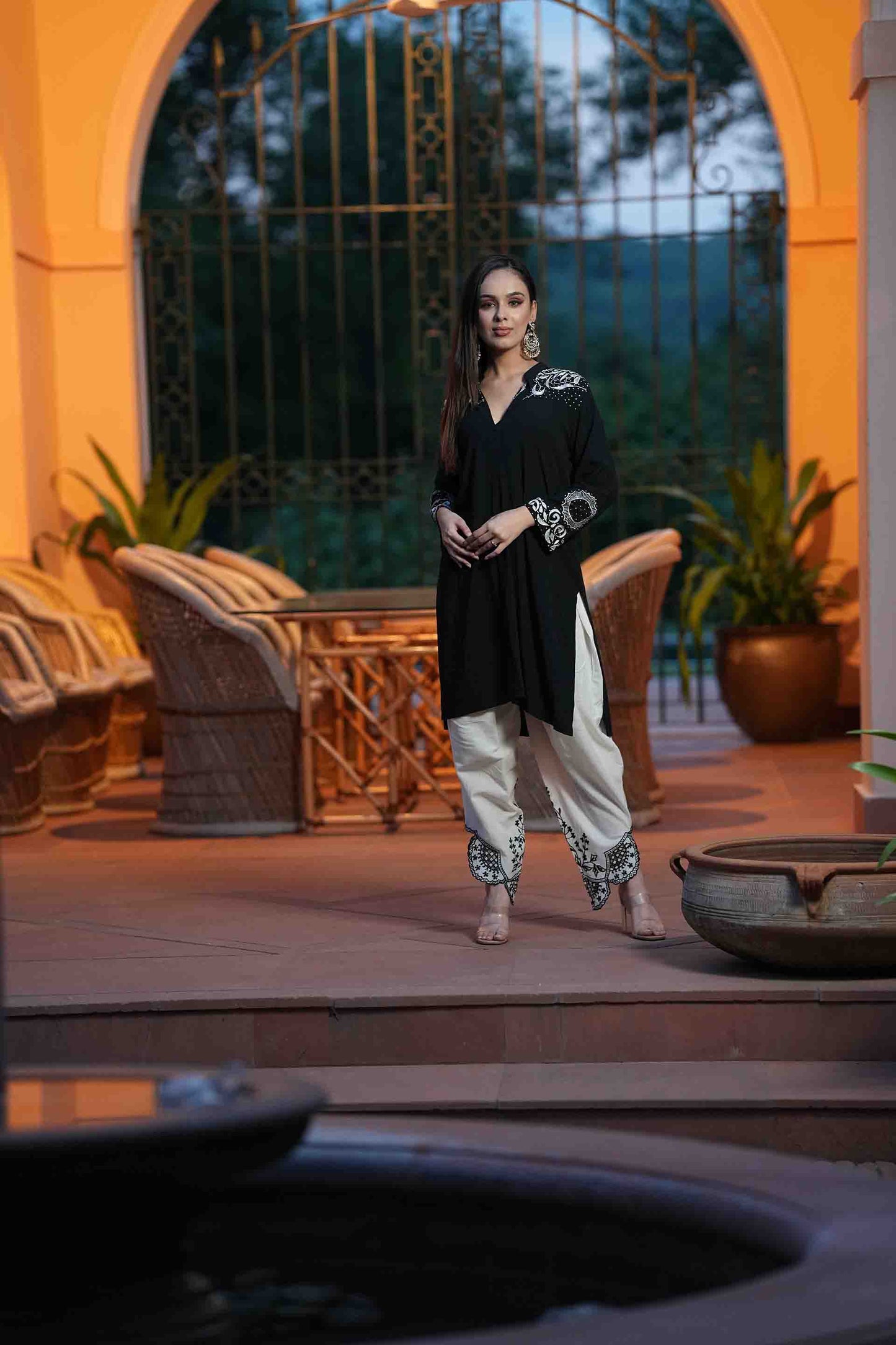 Black kurta with white embroidery and dhoti