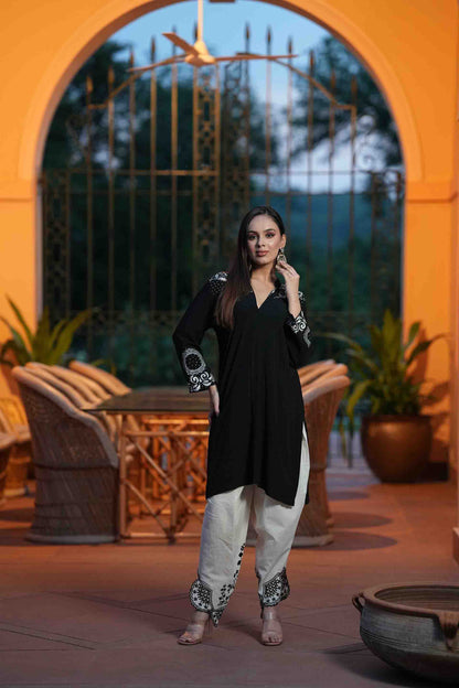 Black kurta with white embroidery and dhoti