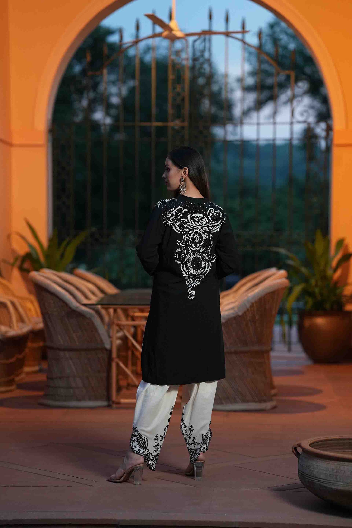 Black kurta with white embroidery and dhoti